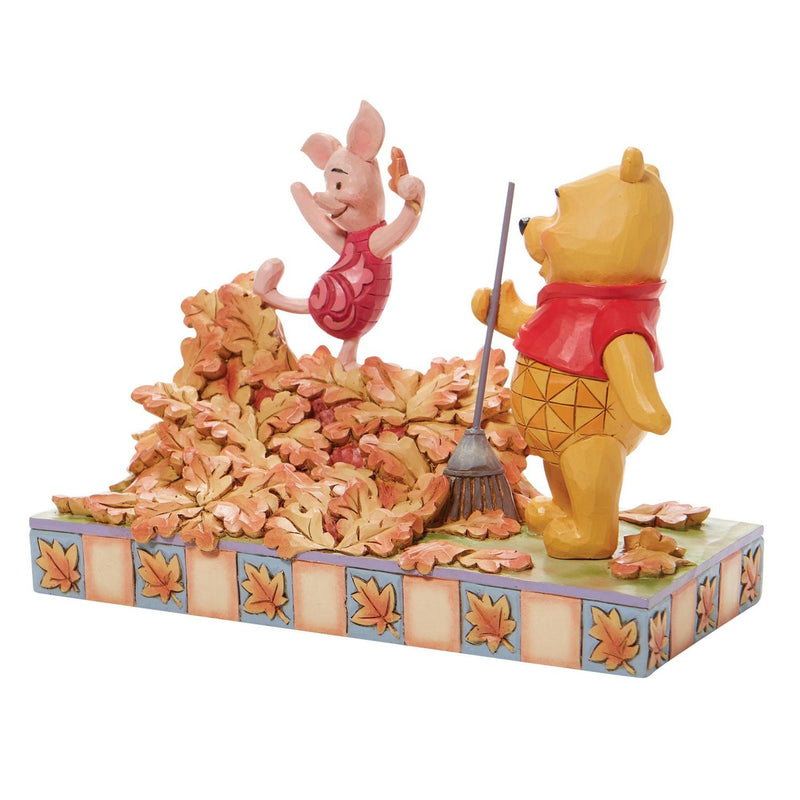 Disney Traditions Winnie The Pooh & Piglet Jumping into Fall Figurine